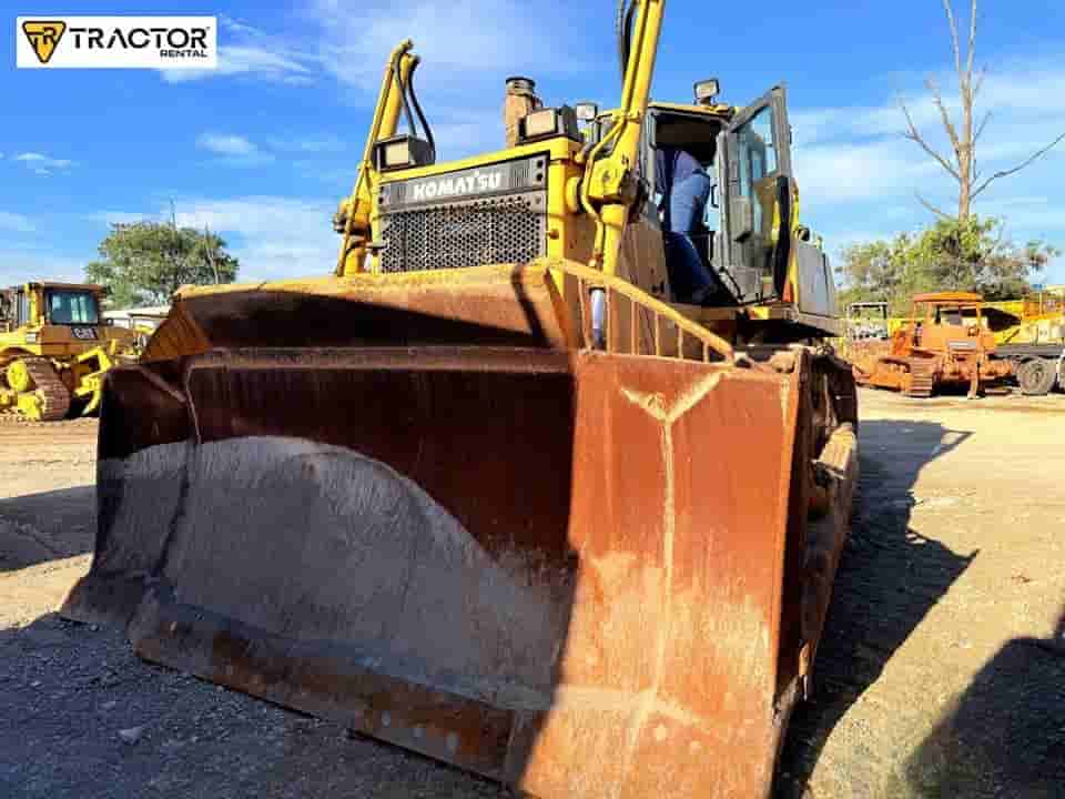 Trator de esteira Komatsu D155AX-6 2009 - imagem de fundo