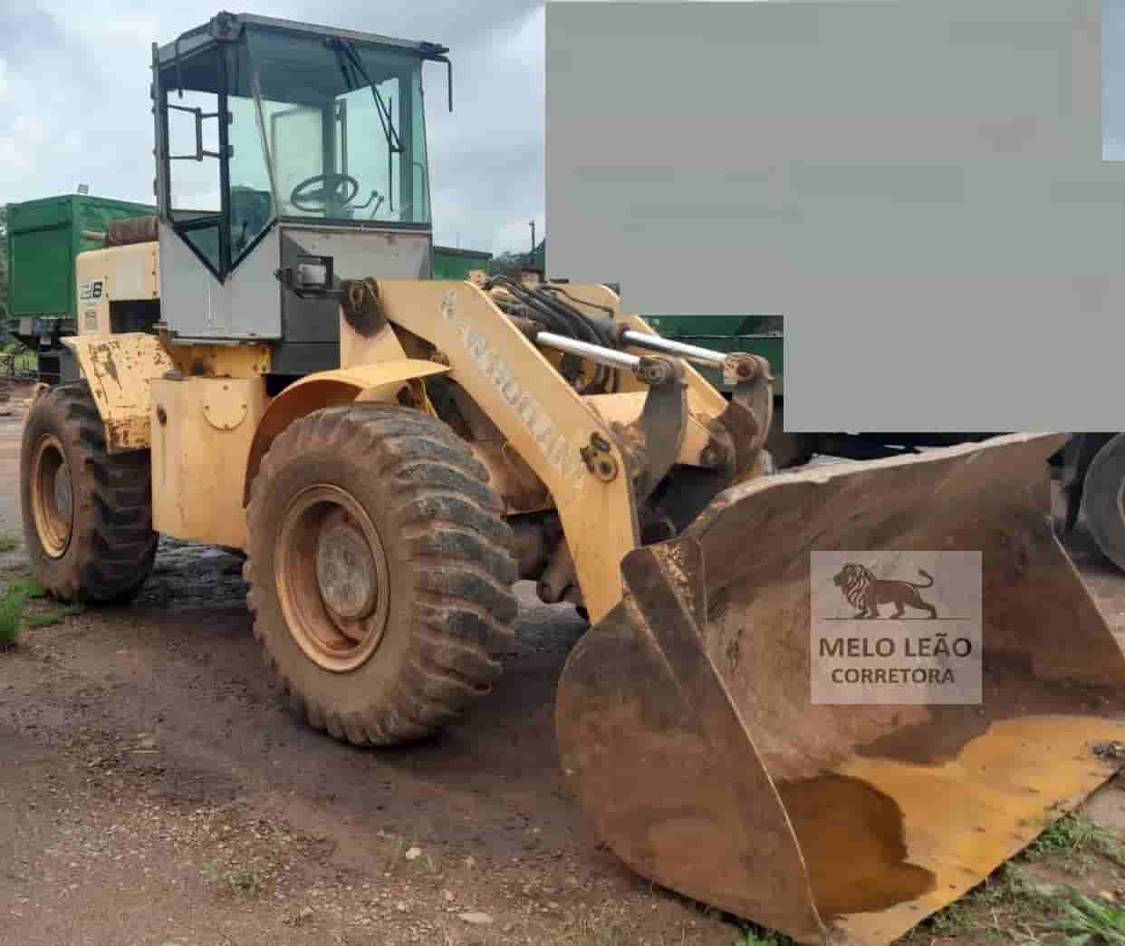 Pá Carregadeira New Holland 12D 2010 - imagem de fundo